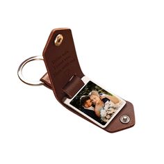 a leather keychain with a photo attached to it