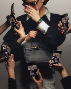 several people holding up their cell phones and taking pictures with the same person's hands