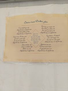 a piece of parchment paper with writing on it that is written in several different languages