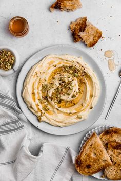 a plate with hummus and bread on it