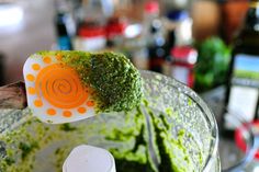 a blender filled with green and orange food