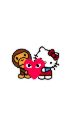 a hello kitty and monkey sticker sitting next to each other