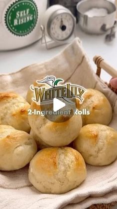 a basket filled with rolls sitting on top of a table