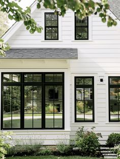 a white house with black trim and windows