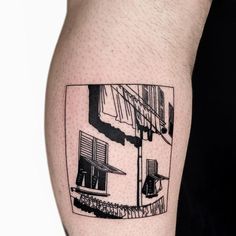 a black and white photo of a man's arm with a tattoo on it