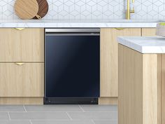 a black dishwasher sitting inside of a kitchen