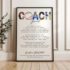 a framed photo with the words coach on it next to a potted plant