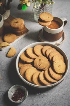 a bowl filled with cookies next to some other items