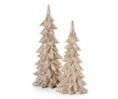 two small gold christmas trees on a white background, one is standing up and the other is sitting down