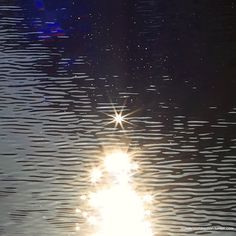 the sun shines brightly in the water as it reflects its reflection on the surface