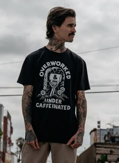 "Overworked Under Caffeinated™", the motto of a generation. The Overworked Under Caffeinated™ unisex crewneck t-shirt is made of high quality and comfy, vintage-inspired garment washed cotton blend fabric. Features: Black Comfy & High-Quality Cotton Blend Fashion-Fit, machine wash. Free Shipping in the US Vans Style Mens, White T Shirt Design, Hunter X Hunter Shirt, Over Worked, Custom Keyboards, Photo T Shirt, Metal Guys, Masc Fashion, Tattoo Shirt