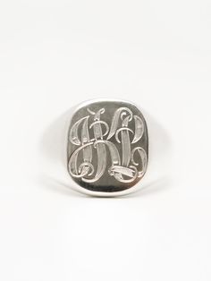 Introducing our timeless monogram signet ring, a true symbol of personalized style and sophistication. Crafted from high-quality materials, this ring features our classic signet design with a flat surface for your personalized monogram engraving. Choose up to three letters to create a unique and personal design that is both stylish and meaningful. Whether you want to display your initials or those of a loved one, this monogram signet ring is the perfect accessory to wear on any occasion. Made to Signet Ring Silver, Dream Wishlist, Silver Signet Ring, Silver Wedding Rings, Personalized Monogram, Recycled Sterling Silver, Magpie, Hand Engraving, Signet Ring