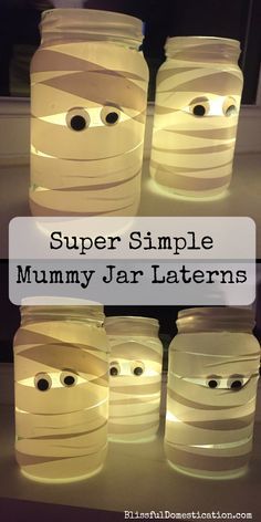 some jars that have faces on them with the words super simple mummy jar lanterns