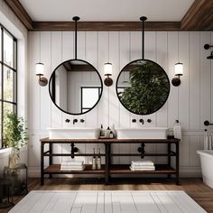 a bathroom with two sinks and mirrors on the wall