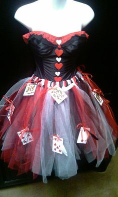 a red and black dress with cards on it