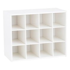 a white shelf with twelve cubes on each side