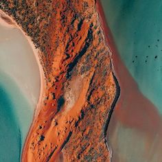 an aerial view of the water and land in this area is very colorful, but it's hard to tell what color you are