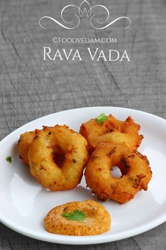 some fried food on a white plate with the words rava vada written above it