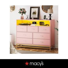 a pink and yellow dresser in a room