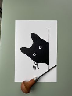 a piece of paper with a drawing of a dog on it's face and a pencil in its mouth