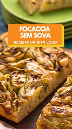 a close up of a pizza on a table with plates in the background and text overlay that reads focaccia sem sova receta da rita lobo