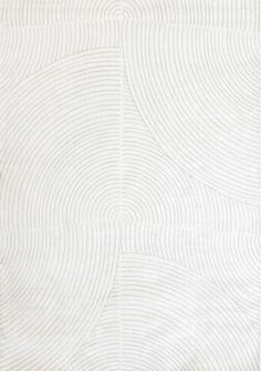 a white rug with wavy lines on it