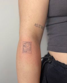 a woman's arm with a stamp on it and the word aster written in cursive ink