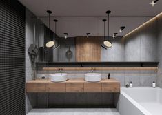 a modern bathroom with two sinks and mirrors