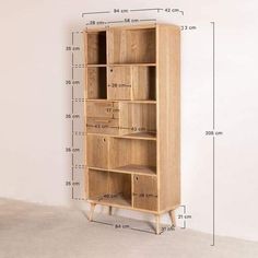 a tall wooden bookcase with measurements for the top and bottom drawers on each shelf