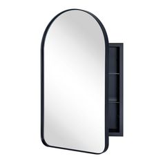 an oval mirror mounted on the wall next to a black shelf with shelves underneath it