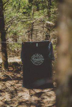 clothes hanging out to dry in the woods