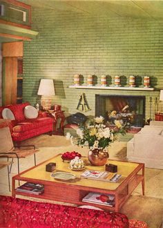 a living room filled with furniture and a fire place in front of a brick wall