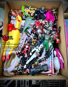 an open box filled with toys and other items