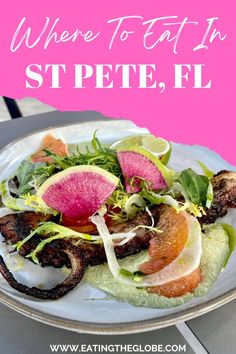 a white plate topped with meat and veggies next to a pink sign that says where to eat in st pete, fl