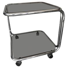 a chrome and glass side table on casteors with wheels, viewed from the front