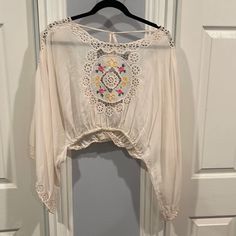 Gorgeous Fillyboo Top With Cutwork, Embroidery And Backless With A Toe At The Back Across Shoulders And Tassels At The Ends, Cropped With Elastic Waist And Huge Sleeves In Excellent Pre Loved Condition Cutwork Top, Angel Sleeves, Cutwork Embroidery, Angel Sleeve, Cut Work, Tassels, Elastic Waist, Top Blouse, Womens Tops