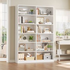 a living room with a white book shelf filled with books