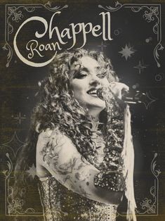 an old photo of a woman with long hair and tattoos on her face, singing into a microphone