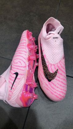 a pair of pink and black nike shoes