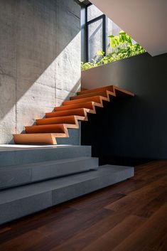 the stairs are made of concrete and wood