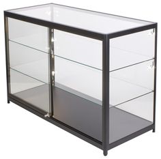 a black and glass display case with lights on the bottom shelf, in front of a white background