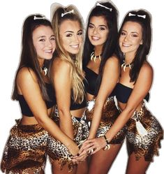 three beautiful young women standing next to each other in front of a white background and wearing leopard print shorts