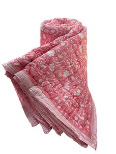 a pink and white scarf with paisley designs