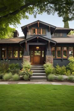 a large house with lots of windows and plants on the front lawn in front of it