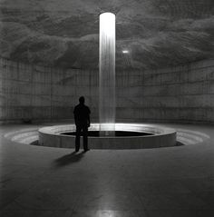 a person standing in front of a fountain