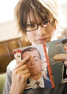 a woman with glasses is reading a book