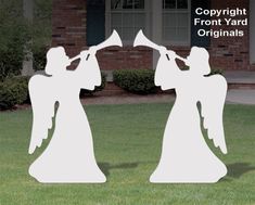 two cutouts of people playing musical instruments in front of a house with the words copyright from yard originals