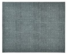 a gray rug with small white dots on the top and bottom, against a white background