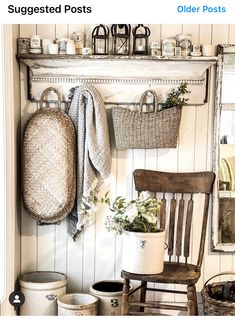 an old chair and some baskets on a shelf in a room with white wood paneling