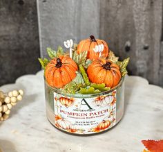 pumpkin patch candles are sitting on a table